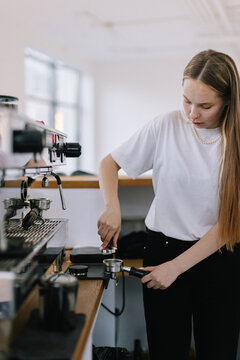 Woman Brewing Coffee At cafeteria