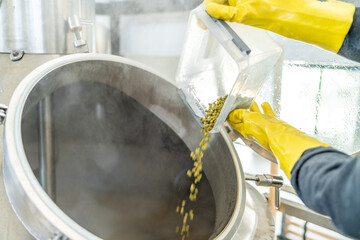 dried granulated hops in the brewery when brewing beer. added to a stainless steel tank when...