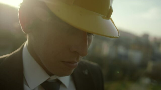 Deep and Meaningful Gaze of a Young Suit-Clad, Beardless, and Beret-Wearing Businessman or Engineer