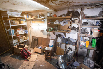 junk in the garage lying in a chaotic and chaotic position, the front and back backgrounds are...