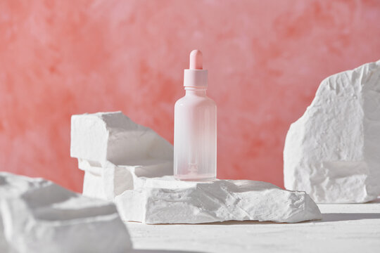 Glass cosmetic Dropper Bottle near travertine stone