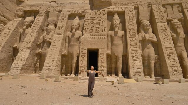 2022 - An interpretive dancer begins a performance outside of the Small Temple of Hathor and Nefertari in Abu Simbel, Egypt.