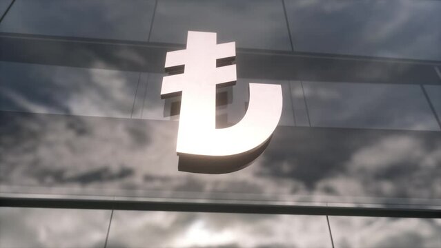 Turkish lira symbol currency sign on a modern glass skyscraper. Mirrored sky and city on modern facade. Business and finance concept