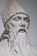 Generic statue of a bearded man dressed in religious clothing.