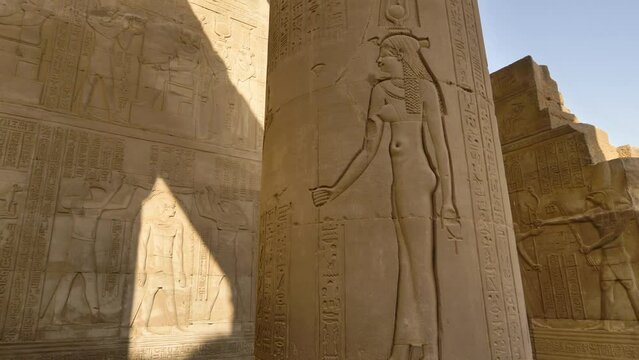 2022 - Rotating view of a shadowed column at Egypt's Temple of Kom Ombo, engraved with hieroglyphs.