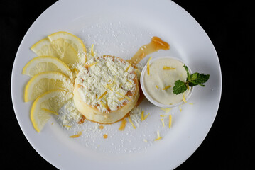 Delicious condensed milk and coconut pudding on a white plate - Coconut pudding with eggs sprinkled with powdered milk
