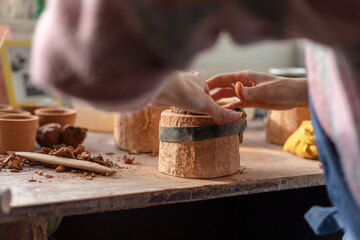 potter sculpts a mold