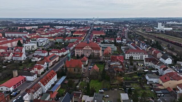 Drone shot revealing Saint Liborius church and "Marie Gerike" Secondary school ("Marie Gerike" Sekundarschule) , Haldensleben , Germany .