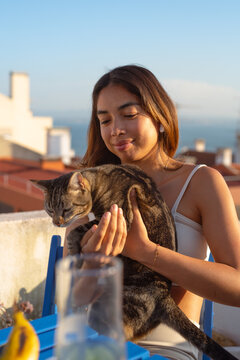 Smiling woman with her cat
