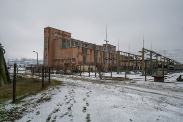 Fototapeta na wymiar The abandoned Inota power plant - a former thermal power plant located in the town of Inota, Hungary