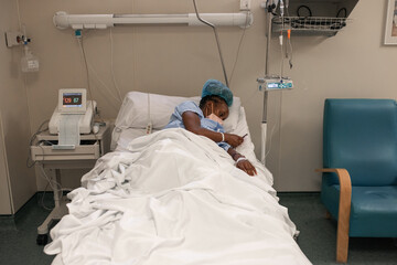 Pregnant woman using cellphone during contractions