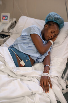 Pregnant black woman resting between contractions