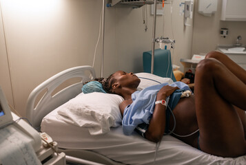 Black woman with CTG belt giving birth