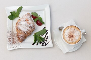 breakfast with coffee and croissant