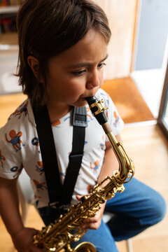kid practicing saxophone