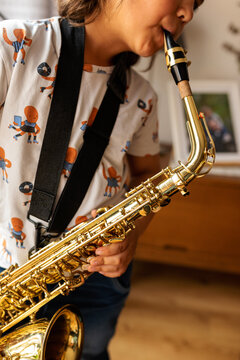 Young boy playing saxophone