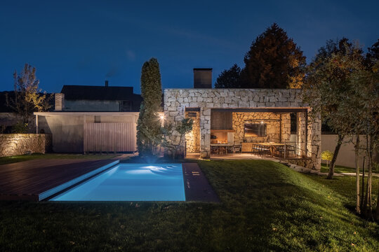 Suburban home from natural materials with outdoor pool