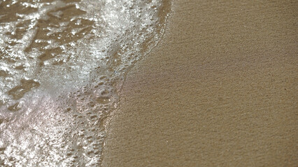 Close up of ocean and sand