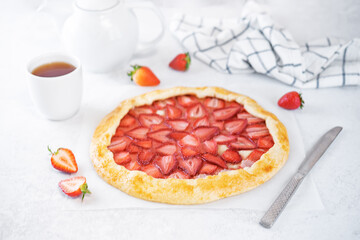 Strawberry galette on a paper sheet