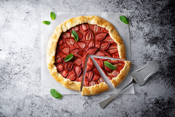 Strawberry galette on a paper sheet