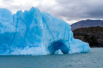 Fototapeta na wymiar A large iceberg floating on the water near Upsala glacier, Santa Cruz Province, Argentina.