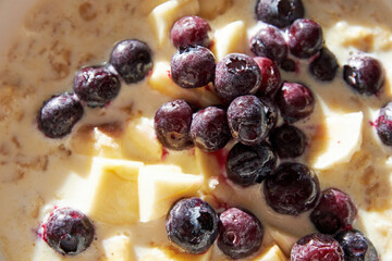 The oatmeal porridge with banana and blueberry for the breakfast. Top view background pattern. Food and drink backgrounds