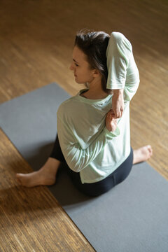 Vertical view of woman with lock hands behind back
