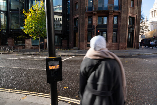 Anonymous Woman With Hijab Waiting To Cross The Street