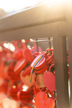 Love padlocks attached to the railing of Colmar bridge