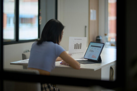 Student studying business from home.