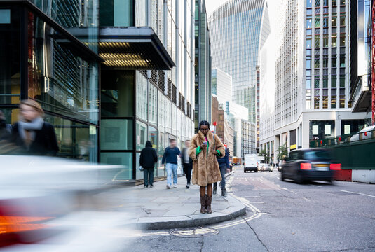 Woman Using Phone In Busy London