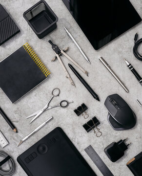 Set of various electronic tools and stationery on desk