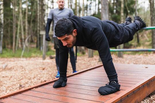 Man doing push ups in outdoor gym