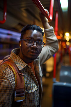 Young commuter waiting to get off metro
