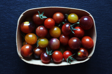 Photography of cherry tomatoes in a wooden crate for food illustrations