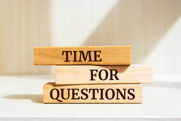 Wooden blocks with words 'Time For Questions'.