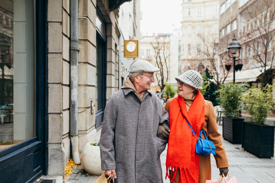 Senior Man and Woman Shopping in City