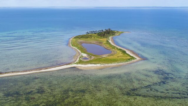 Drone Flying Backwards Over Small Island Of Alholm In Denmark 4K