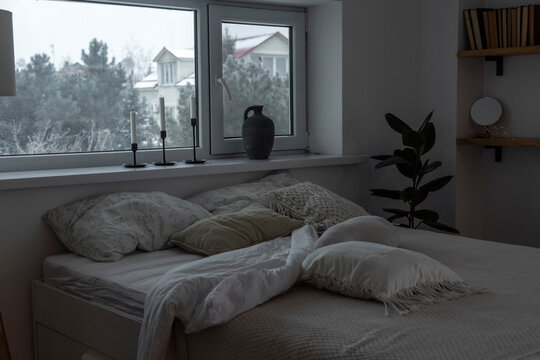 Monochrome bedroom with cozy bed