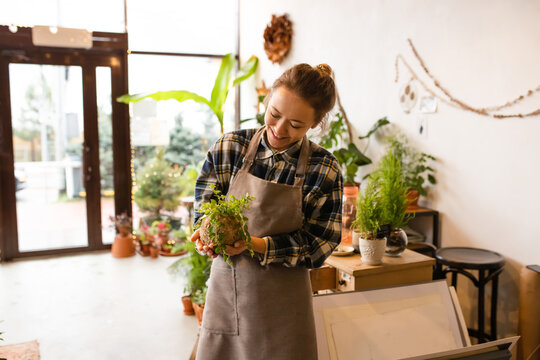 Young Woman `In Flower Shop