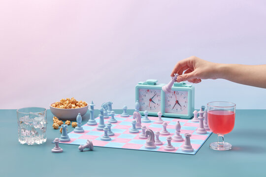 Chess with heart pattern, woman hold chess queen.