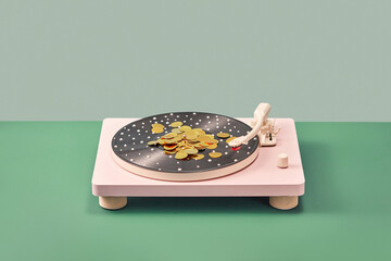 Stylish record player covered with gold confetti.