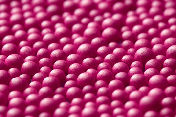Pink background with shiny spheres.