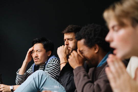 Friends Watching Match at Home