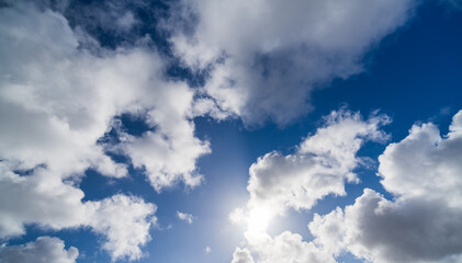 Obraz premium blue sky with clouds and sun rays