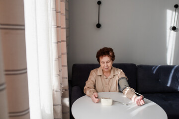 Senior Woman Measuring Blood Pressure