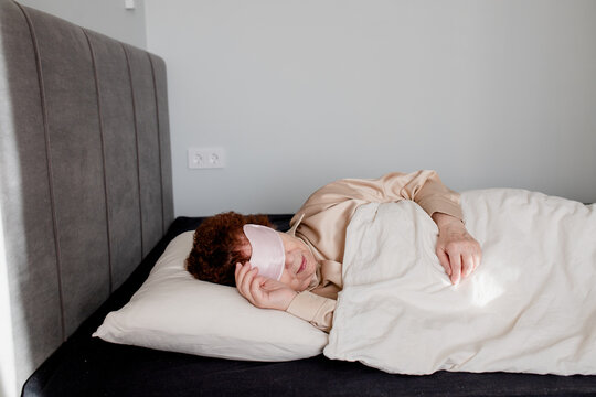 Senior Woman Using Sleep Mask