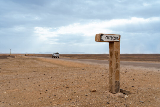 Cafe sign along a road in the desert