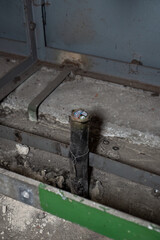 The rest of the cut cable by the floor.