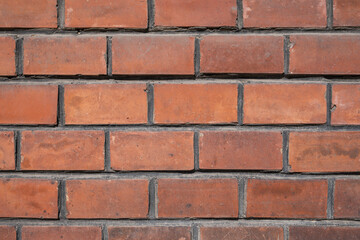 Old red brick exterior wall.